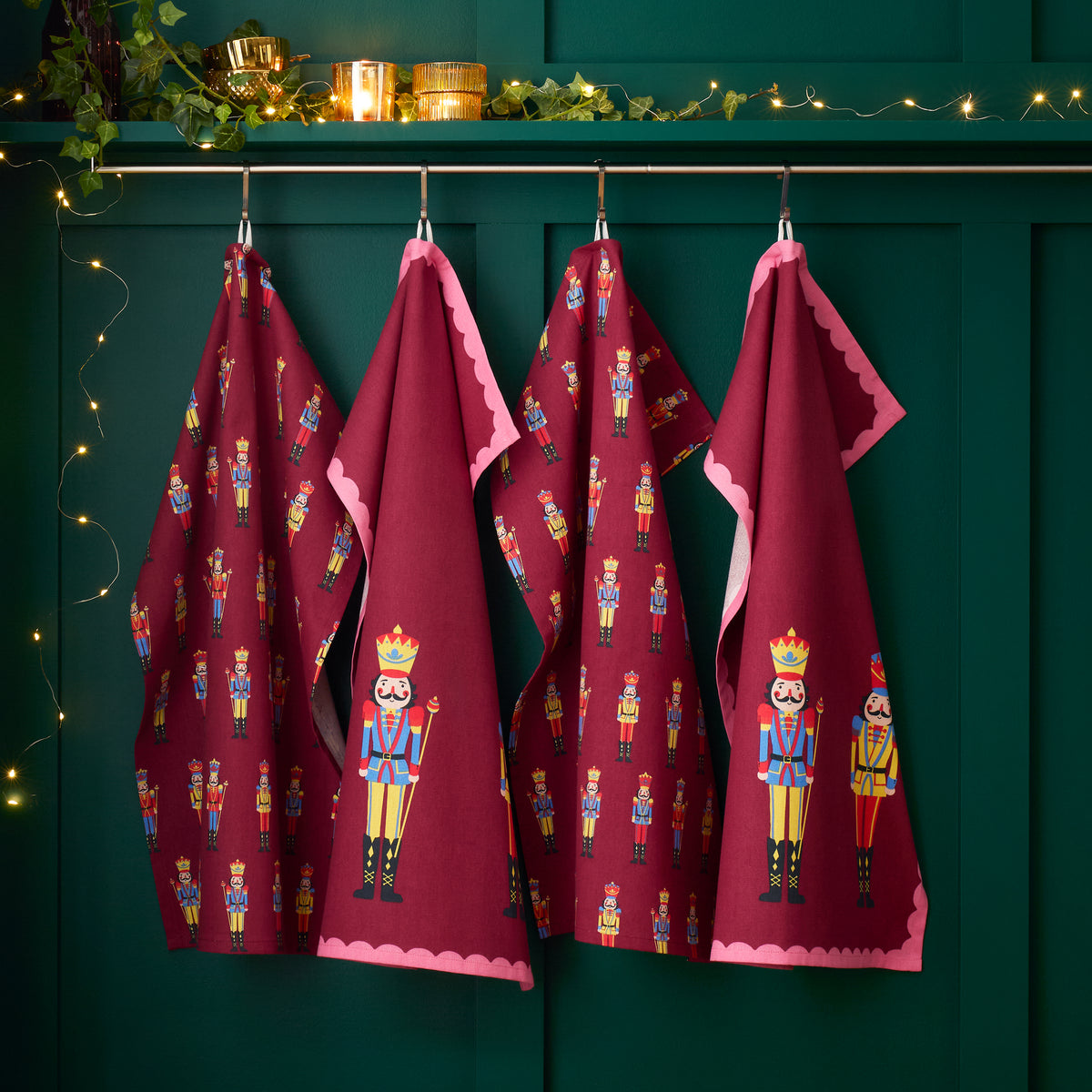 Catherine Lansfield Christmas Nutcracker Tea Towels (Pack of 4) - Plum